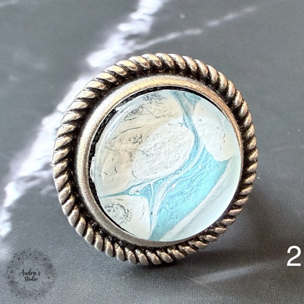 Hand-poured acrylic fluid art ring number 2 in an antique silver adjustable rope-edge setting