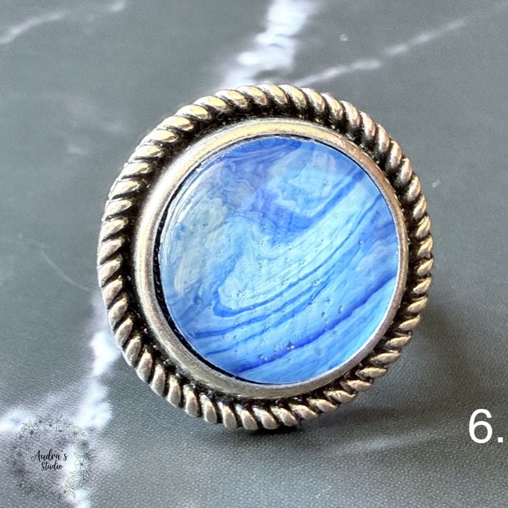 Hand-poured acrylic fluid art ring number 6 in an antique silver adjustable rope-edge setting